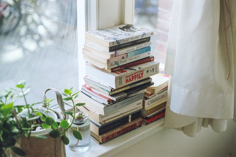 Books on a window sill 