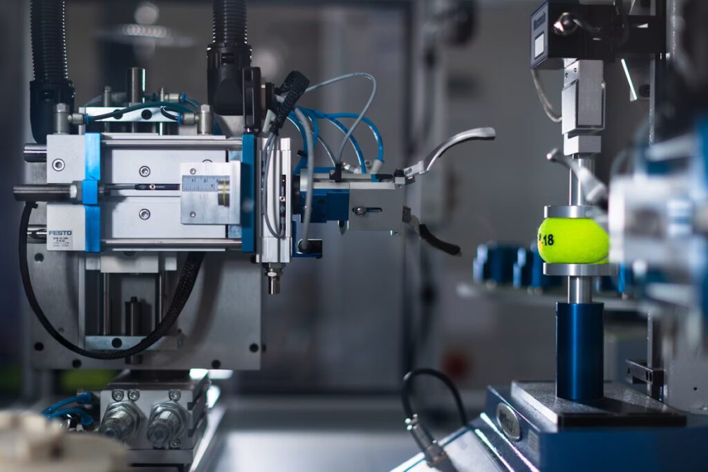 Machine stress testing a tennis ball.