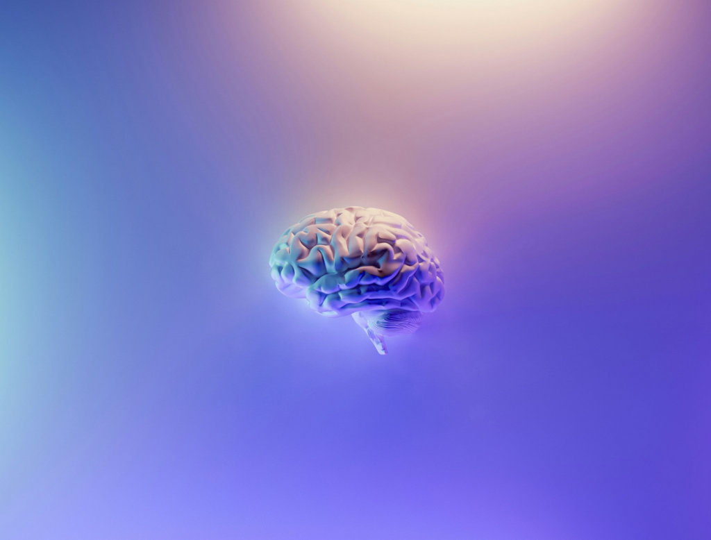 An image of a CGI brain on a purple background. 